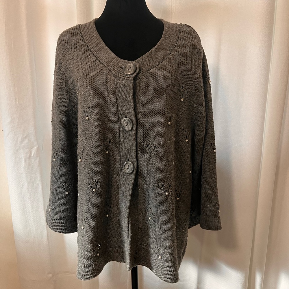 Grey sweater with pearl accents.